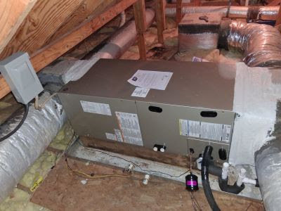 An HVAC air handler unit installed in an attic with ductwork by Reasonable Air, LLC in Summerville, SC.