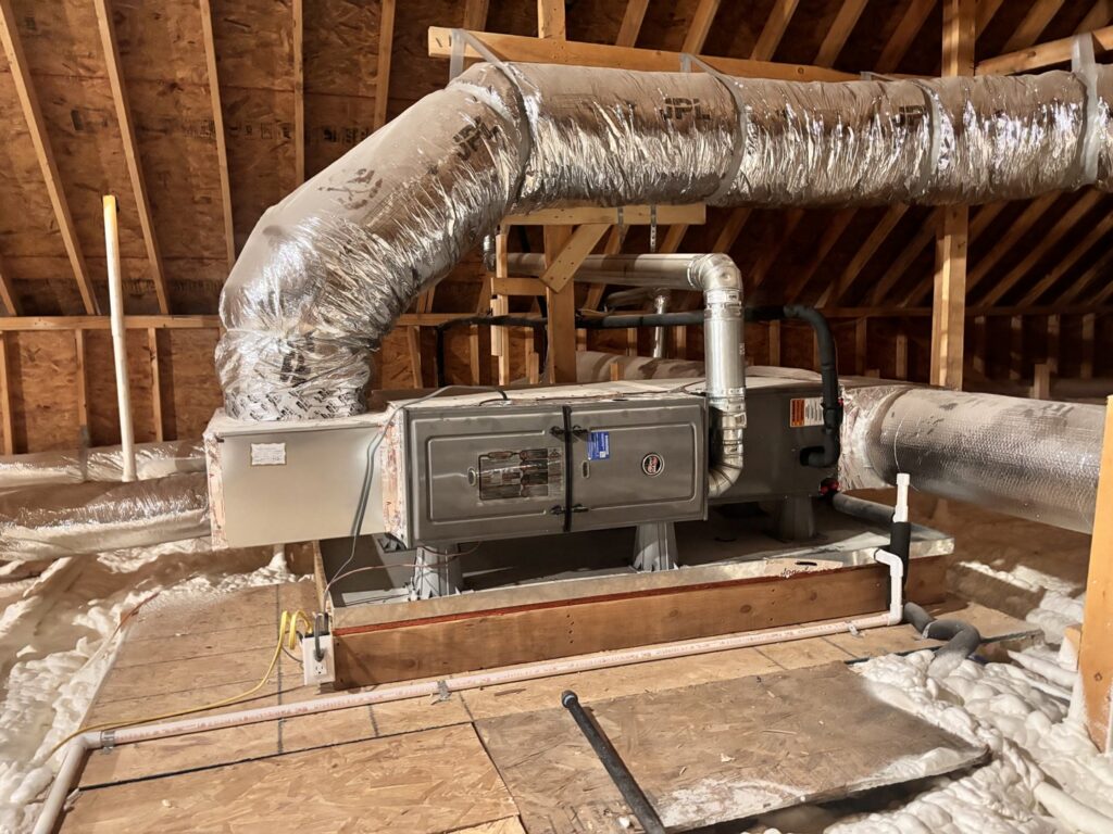 HVAC air handler and insulated ducts installed in an attic by ACE Heating & Cooling, Inc. in Jonesboro, AR