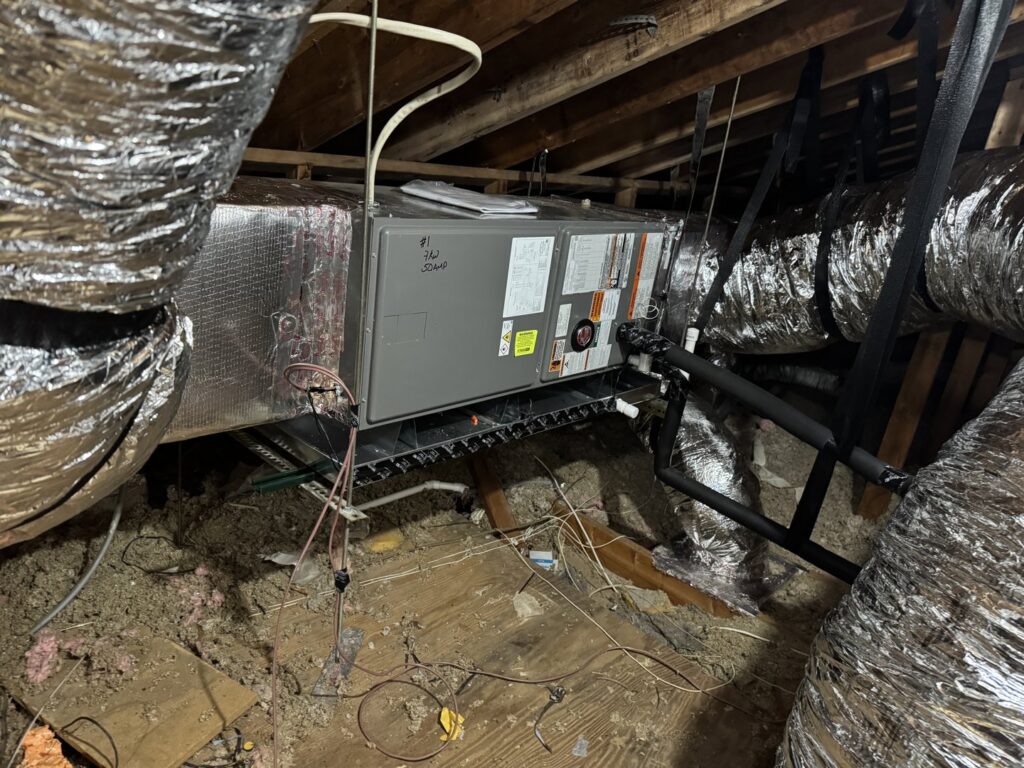 An HVAC air handler unit and ductwork installed in an attic by Air Support Cooling and Heating, LLC in Tampa, FL