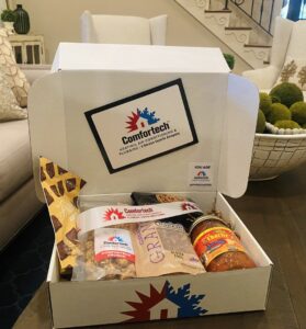 A large HVAC air handler unit and ductwork installed in an attic by Comfortech-Service Experts Jackson in Jackson, MS