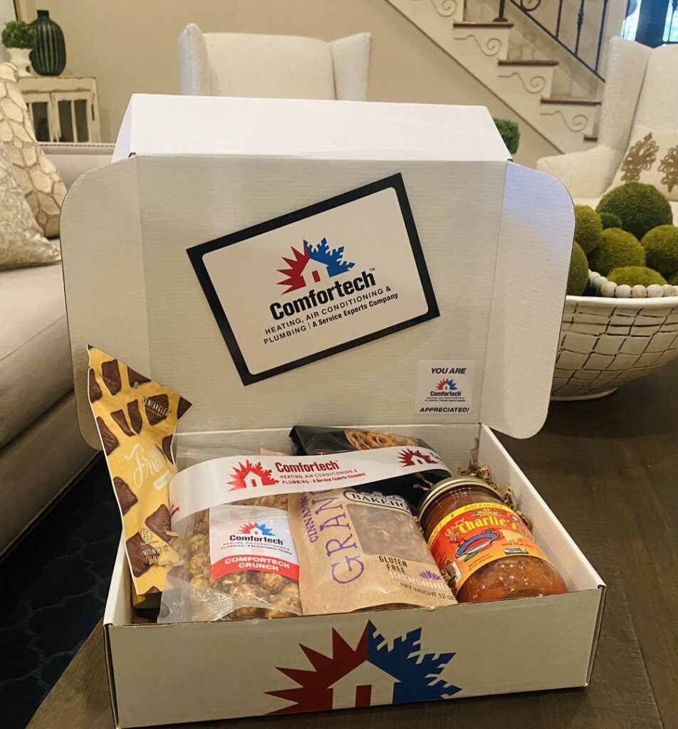 A large HVAC air handler unit and ductwork installed in an attic by Comfortech-Service Experts Jackson in Jackson, MS