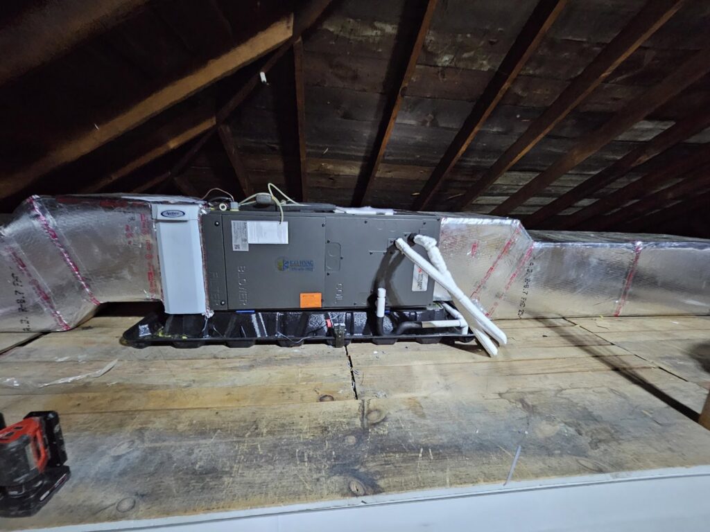 An HVAC air handler unit with insulated ductwork installed in an attic space by KO HVAC Heating & Cooling in Kingston, PA.