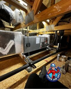 An HVAC air handler unit and ductwork installed in an attic space by QUICK AIR USA in Orlando, FL.
