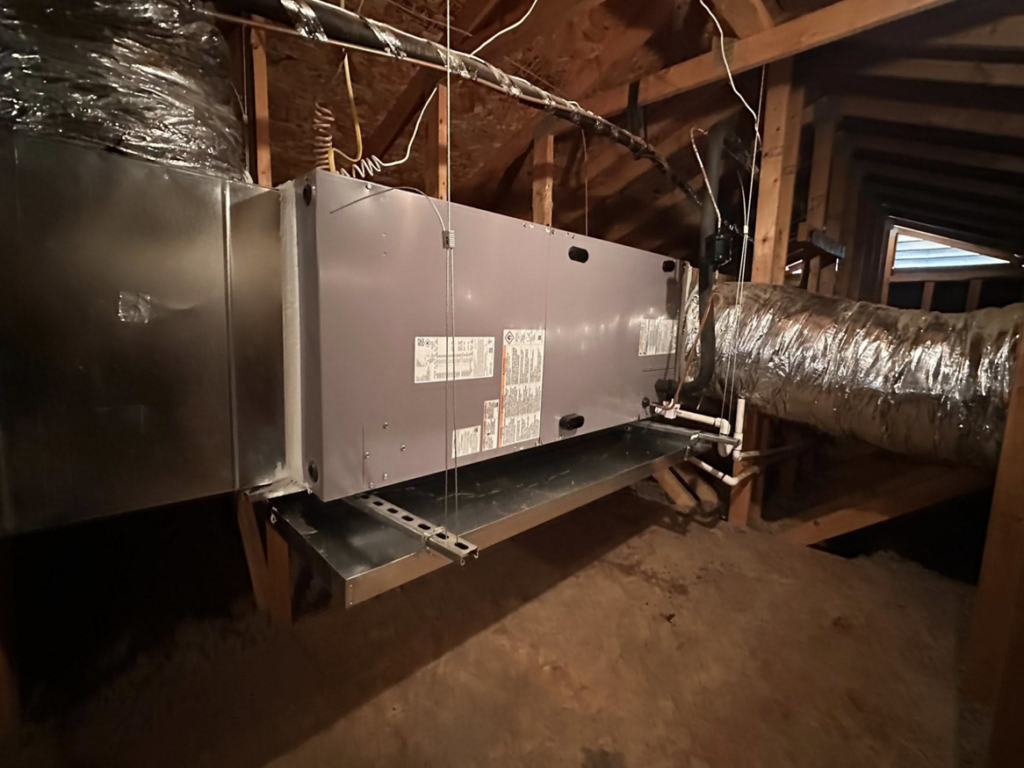 An HVAC air handler unit and ductwork installed in an attic by Weather Masters, Inc. in Mesa, AZ.