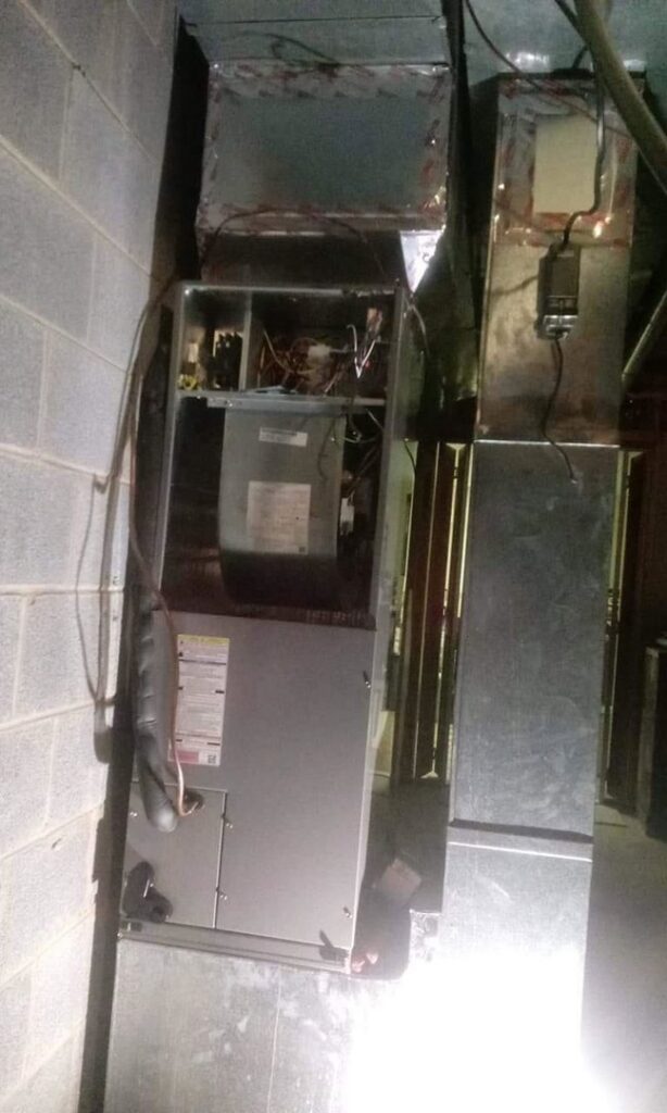 An HVAC air handler unit with connected ductwork, installed by ReDesign Air in Winchester, VA.