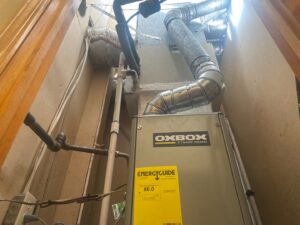 An HVAC air handler unit with connected ductwork, installed by The Montz Company in Kentwood, LA