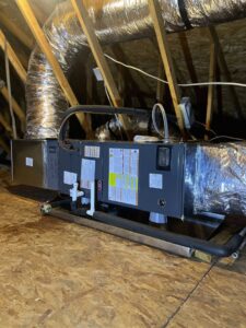 An HVAC air handler unit and ductwork installed in an attic by Brand Air Heating and Cooling LLC in Wilmington, NC.