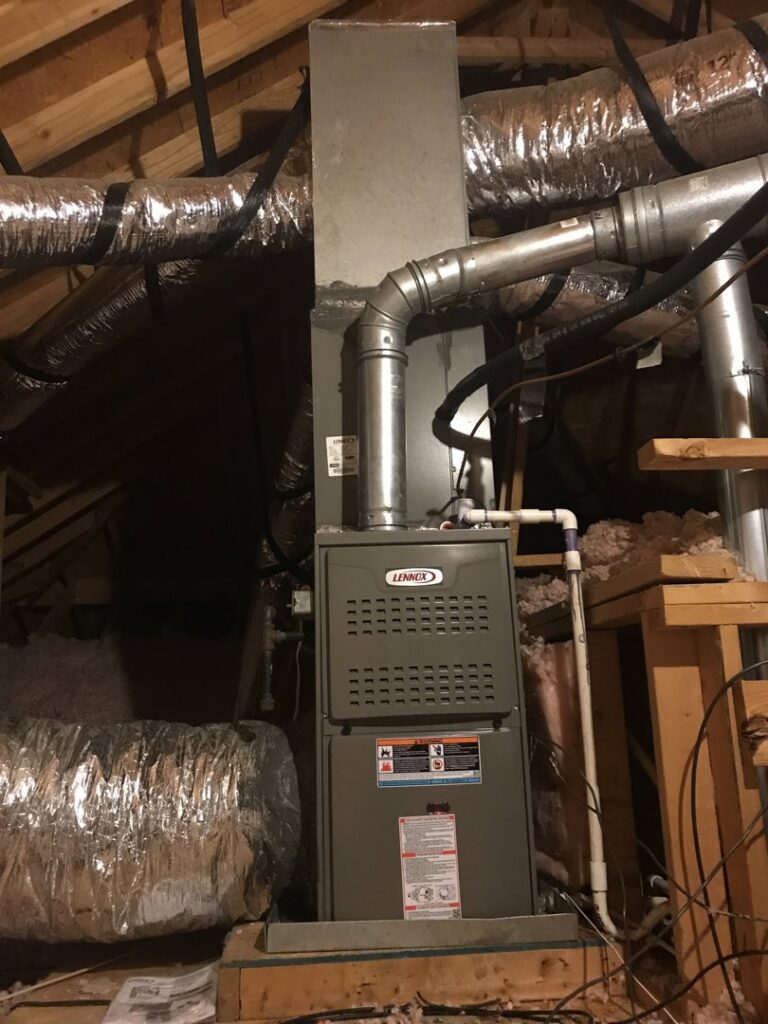 An indoor HVAC air handler unit with ductwork installed in an attic by Gouker's Best Air in Franklin, TN.