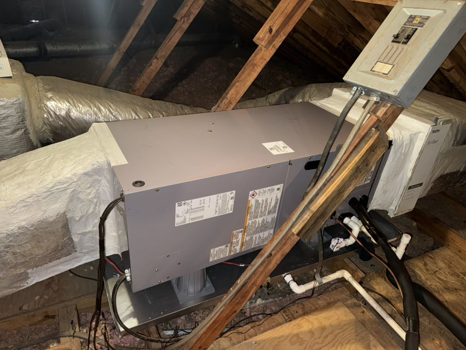 An HVAC air handler unit and ductwork installed in an attic by Kirk Heating & Air Conditioning in Summerville, SC.