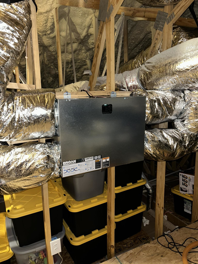 An HVAC air handler unit and ductwork professionally installed in an attic by TRI AC, providing efficient climate control in Canton, GA.