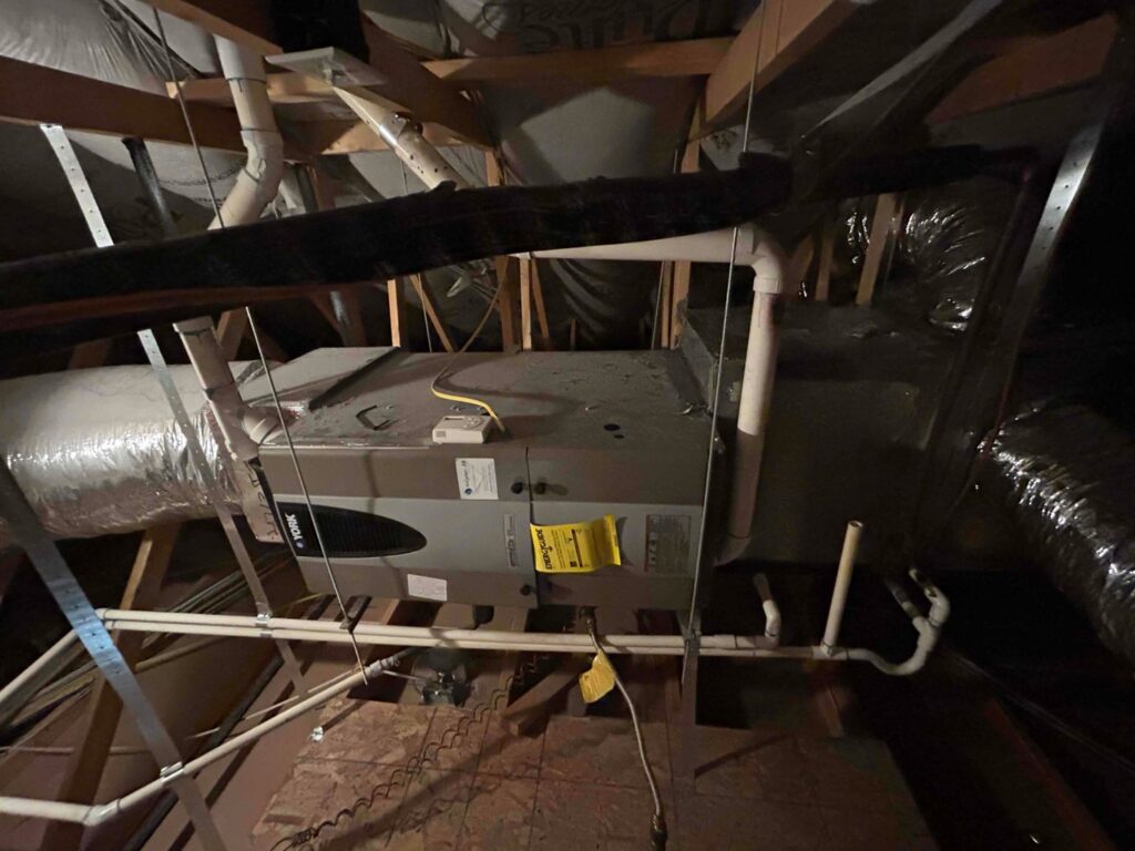An HVAC air handler unit and ductwork installed in an attic by Sahara Air Conditioning & Heating in Las Vegas, NV