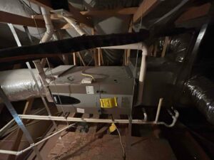 An HVAC air handler unit and ductwork installed in an attic by Sahara Air Conditioning & Heating in Las Vegas, NV
