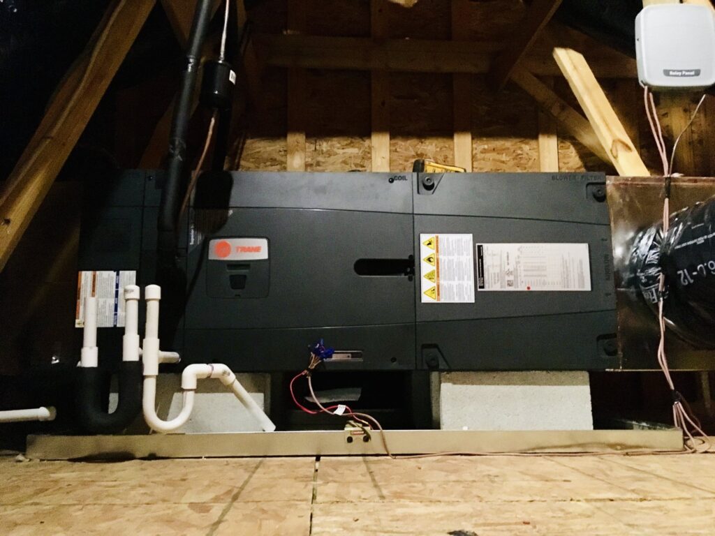 An HVAC air handler unit installed in an attic space by Modern Mechanical HVAC in Garner, NC.
