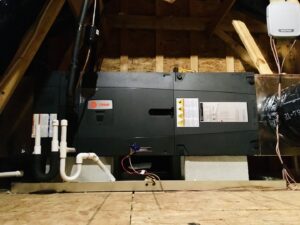 An HVAC air handler unit installed in an attic space by Modern Mechanical HVAC in Garner, NC.