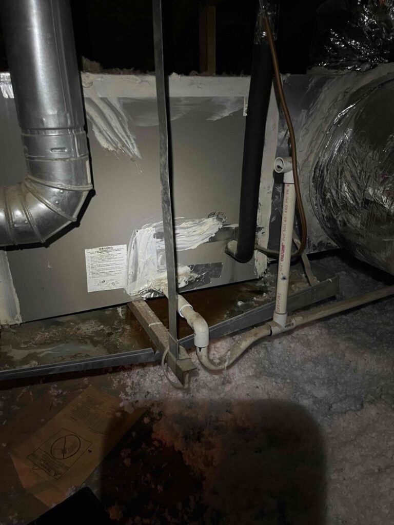 An HVAC air handler unit showing water damage and insulation issues, requiring repair by One Hour Heating & Air Conditioning of West Valley in Phoenix, AZ