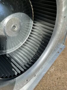 A close-up view of an HVAC blower fan component, ready for inspection or cleaning by Fix It Now Heating and Cooling in Thornton, CO