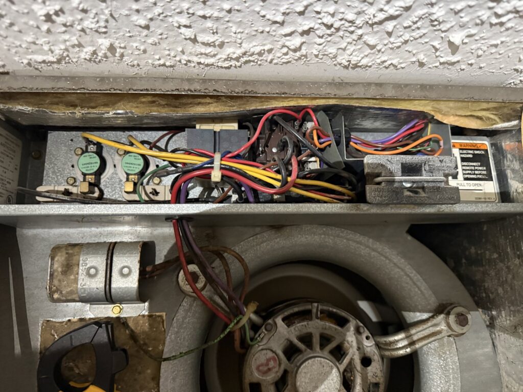Close-up of an HVAC blower fan and electrical components during service by Direct Service HVAC & Maintenance in Lewisburg, OH.