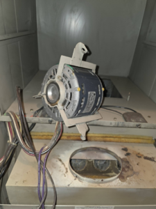 An HVAC blower motor removed for service by Affordable Quality Air Duct Cleaning in Denver, CO