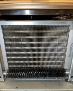 A close-up view of an HVAC coil being cleaned by CW Mechanical HVACR in Lehi, UT.