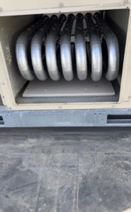 A close-up view of an HVAC coil inside a unit at Schomp's Mechanical Services in Brookings, SD.