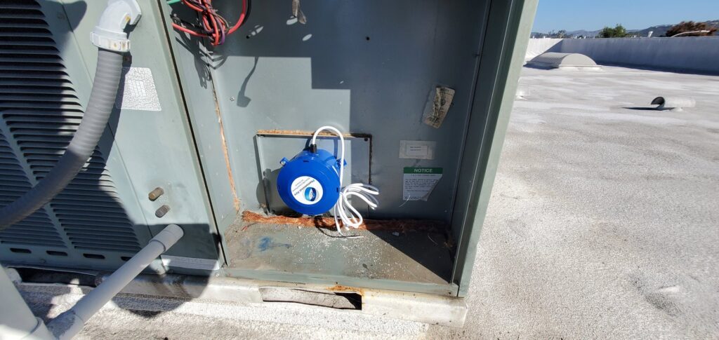 A close-up view of an internal component inside an outdoor HVAC unit being serviced by Hurn Mechanical Heating & Cooling in El Cajon, CA.