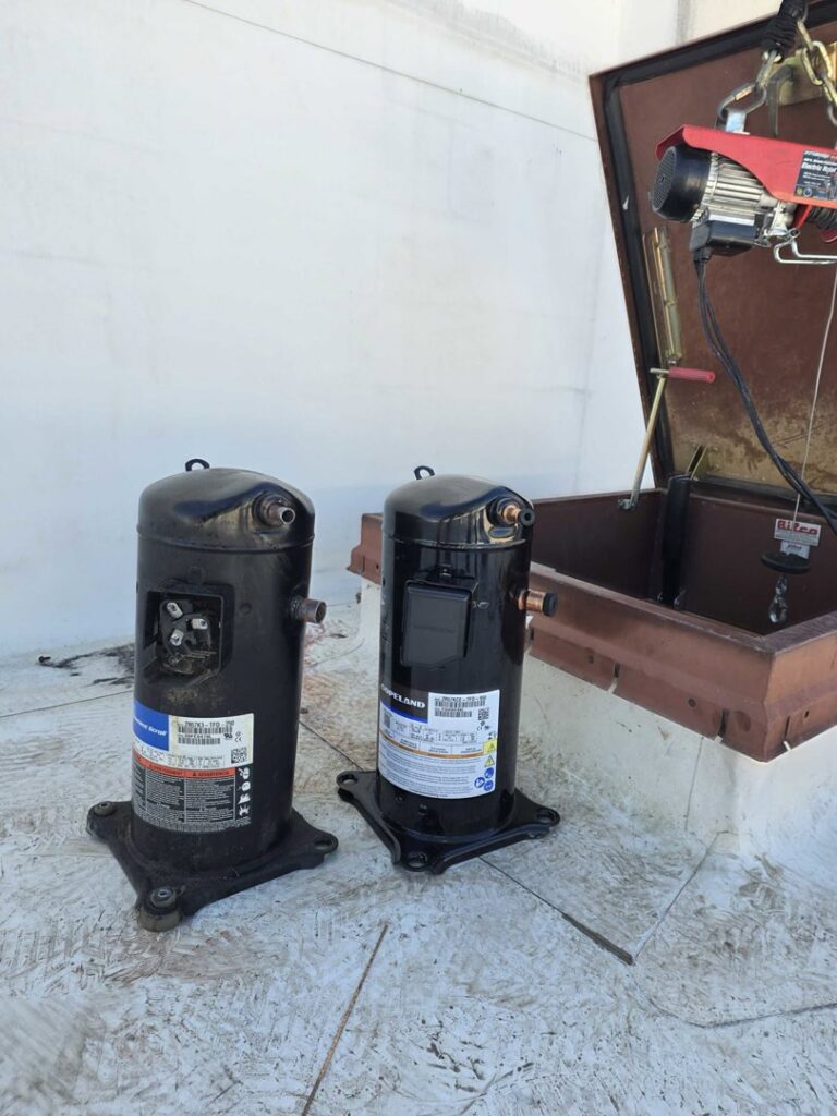 New HVAC compressors on a rooftop, ready for replacement or installation by SBS-NC, LLC in High Point, NC