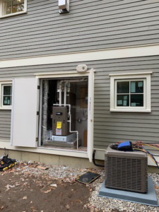 Outdoor HVAC condenser and indoor furnace/air handler installation by Paul Mechanical LLC in Merrimack, NH