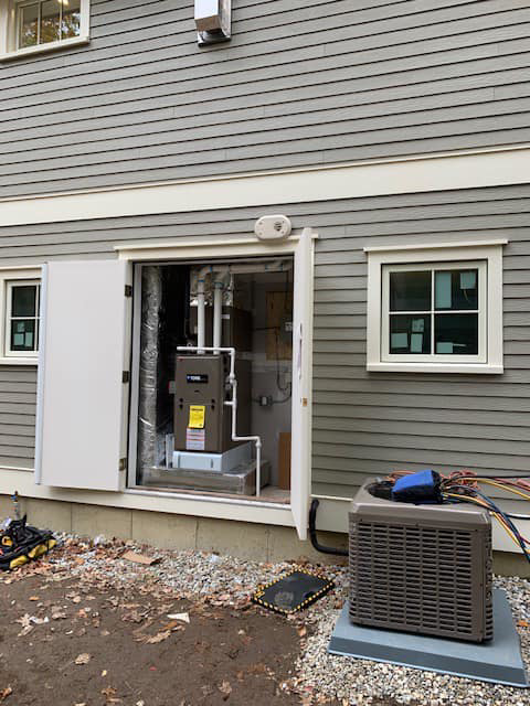 Outdoor HVAC condenser and indoor furnace/air handler installation by Paul Mechanical LLC in Merrimack, NH