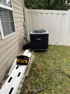 An outdoor HVAC condenser unit during a service call by Reasonable Air, LLC in Summerville, SC.