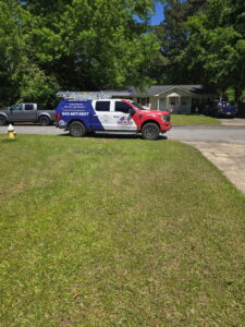 An American Air Solutions HVAC contractor truck parked on a residential street in Summerville, SC, ready for a service call.