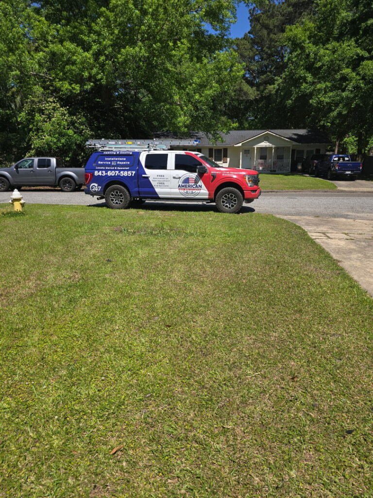 An American Air Solutions HVAC contractor truck parked on a residential street in Summerville, SC, ready for a service call.