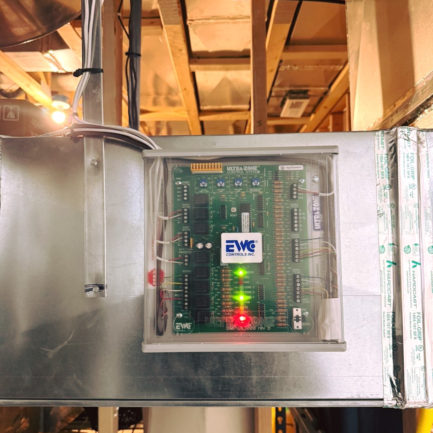 An HVAC control board, an Ultra-Zone Control System, installed within ductwork by One Way Service Pros in Deadwood, SD.
