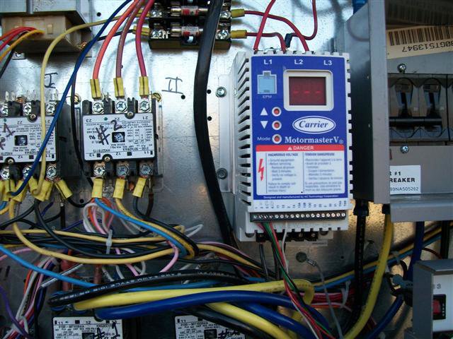 Close-up of an HVAC control board and electrical wiring inside a unit by Glendale HVAC in Glendale, AZ