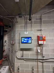 An HVAC control panel with a touchscreen display installed by ICM Mechanical & Controls, LLC in Fall River, MA