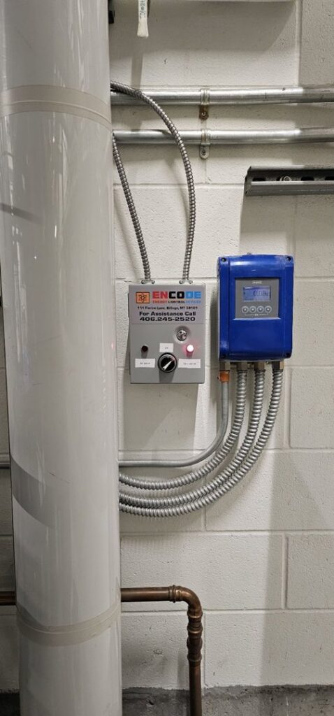 An HVAC control panel next to a water heater, showcasing energy control services from Encode Corporation in Billings, MT.