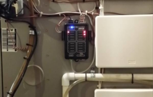 Close-up of an HVAC control panel and wiring, showcasing technical work by Elite Heating & Cooling in Knoxville, TN.