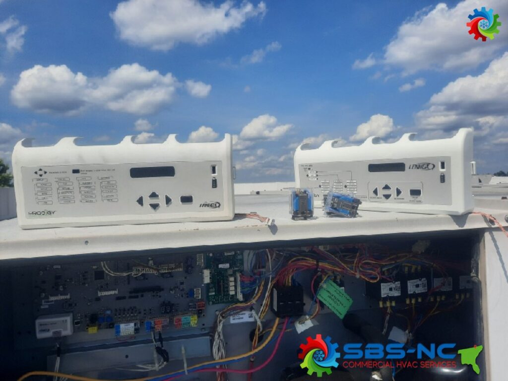 HVAC control panels and intricate wiring on a rooftop unit, serviced by SBS-NC, LLC in High Point, NC.