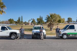 Modern Air Conditioning & Heating crew standing with their service fleet of vehicles in Boulder City, NV.