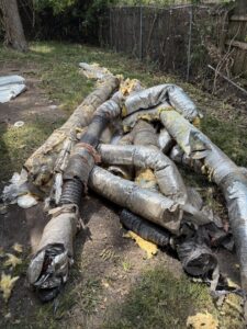 A pile of old HVAC ducts and insulation removed from a property by Bosley Heating and Cooling in Phenix City, AL.