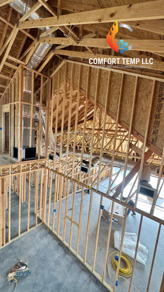 HVAC ducts installed within the wooden framing of a new construction home by Comfort Temp HVAC LLC in Fort Smith, AR