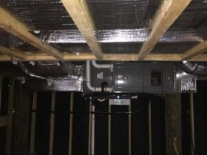 HVAC ductwork and an air handler unit installed in a ceiling space by Accurate Conditioning in Sayreville, NJ.