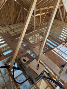 HVAC ductwork and an air handler unit being installed in a new construction attic by Circle L Heating and Cooling LLC in Atmore, AL.