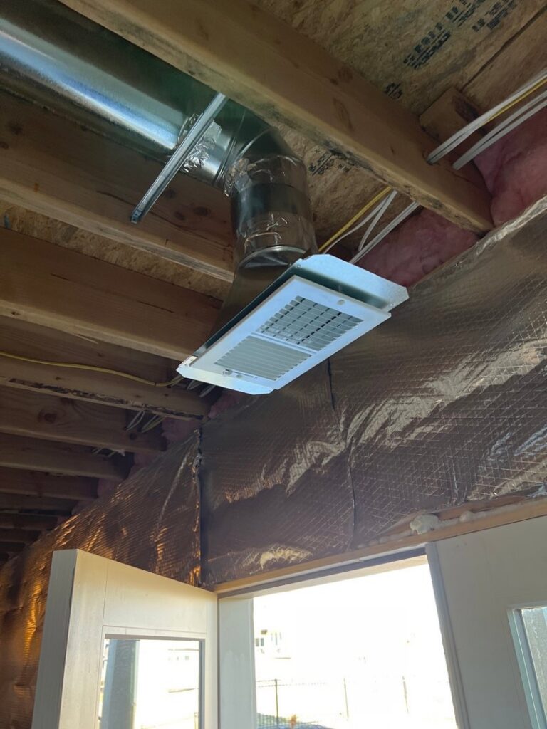 New HVAC ductwork and a ceiling vent installed by Spartan Mechanical KC, providing air distribution in Spring Hill, KS.