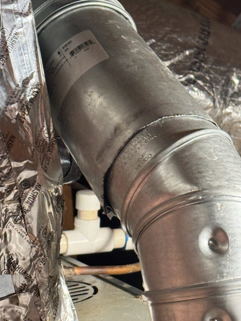 Close-up of HVAC ductwork and piping installation by C&K Air and Heating, Inc. in Olive Branch, MS.