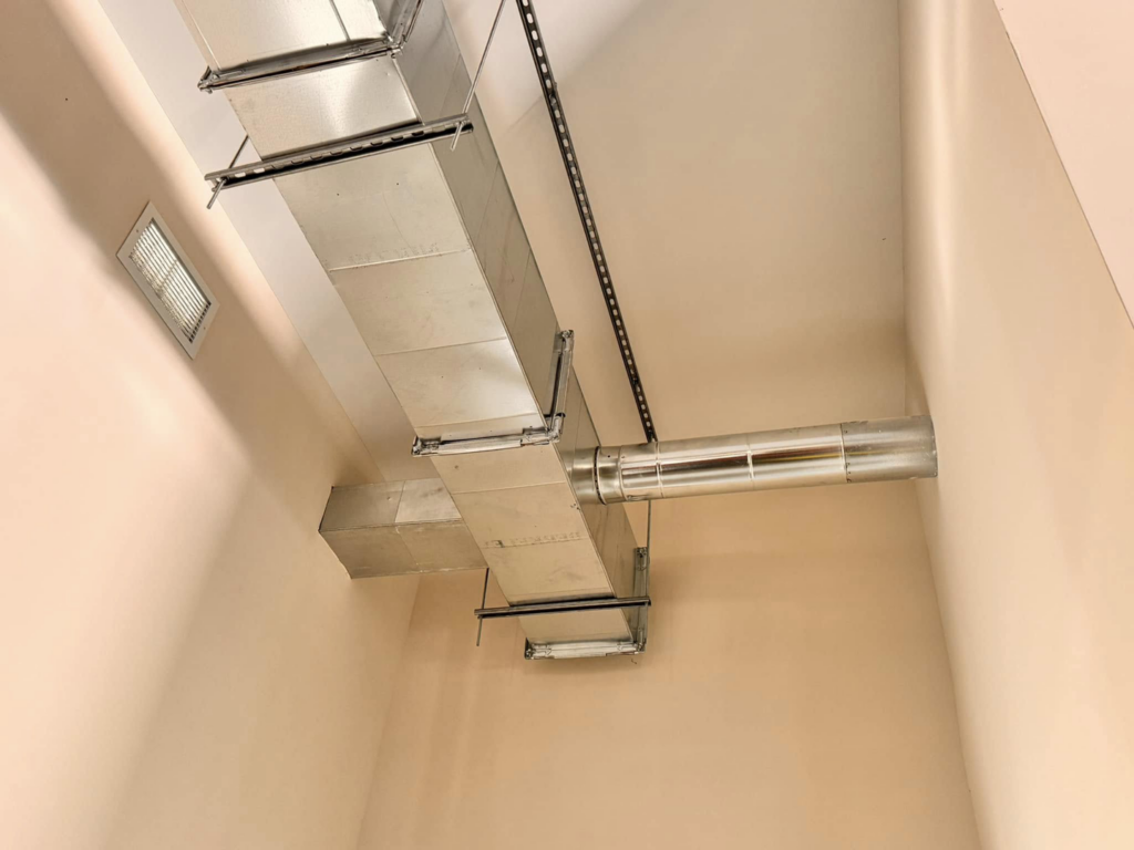 Close-up of installed HVAC ductwork and a supply vent by Buck'n Bull HVAC Solutions in Wilmington, NC