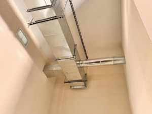 Close-up of installed HVAC ductwork and a supply vent by Buck'n Bull HVAC Solutions in Wilmington, NC