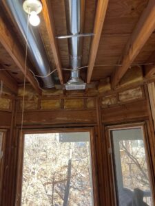 HVAC ductwork and a new vent installed in a ceiling by Spartan Mechanical KC, serving Spring Hill, KS.