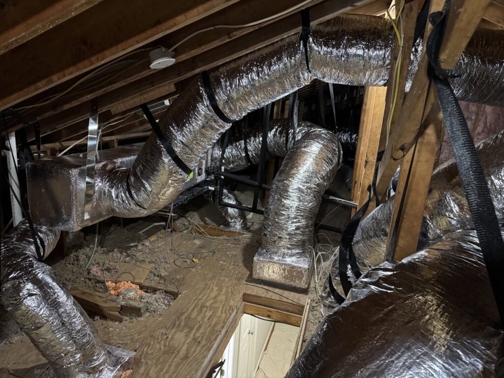 Newly installed HVAC ductwork visible in an attic by Air Support Cooling and Heating, LLC in Tampa, FL