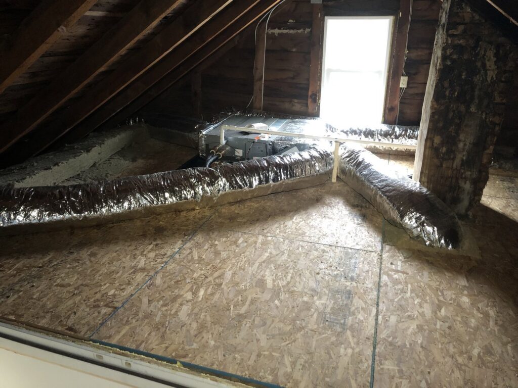 HVAC ductwork and an air handler unit installed in an attic space by Garrison City HVACR in Dover, NH