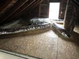 HVAC ductwork and an air handler unit installed in an attic space by Garrison City HVACR in Dover, NH